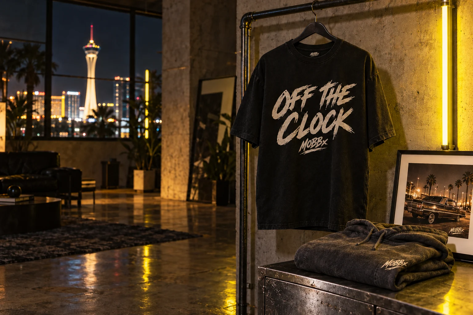 MOBBx-branded off the Clock graphic tee and charcoal hoodie styled in a nighttime studio
